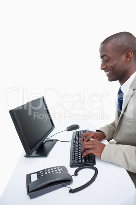 Side view of a businessman using a computer