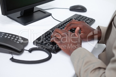 Close up of masculine hands typing