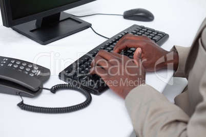 Close up of masculine hands typing with a keyboard