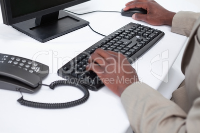 Close up of masculine hands using a computer