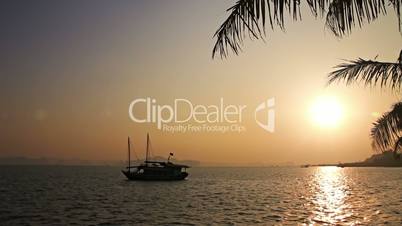 Tropical sunset with boat