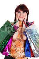 Beautiful happy woman with shopping bags isolated