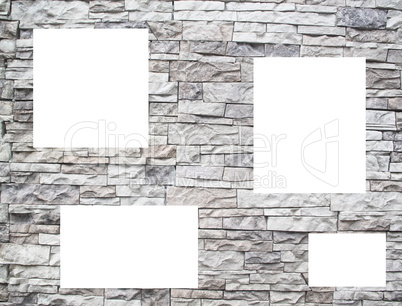 A stone wall with white windows