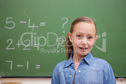 Smiling schoolgirl posing