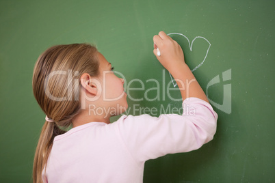 Schoolgirl drawing a heart