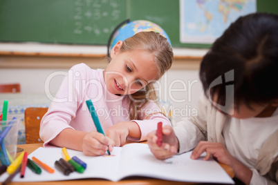 Cute schoolgirls drawing