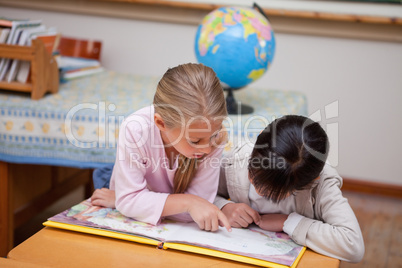 Schoolgirls reading a fairy tale