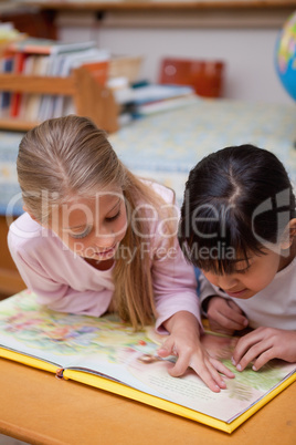 Portrait of schoolgirls reading a fairy tale