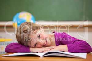 Schoolgirl leaning on her desk