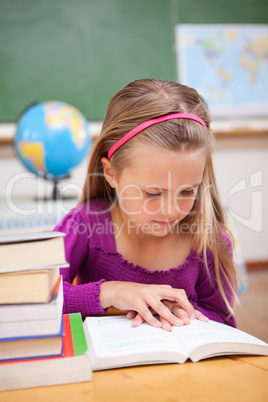 Portrait of schoolgirl reading a book