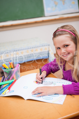 Portrait of a schoolgirl drawing