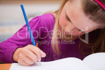 Close up of a schoolgirl writing