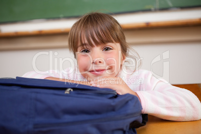 Cute schoolgirl posing with a bag