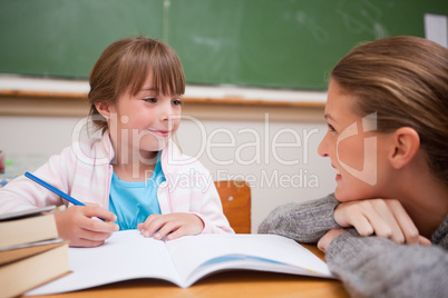 A teacher and a schoolgirl talking