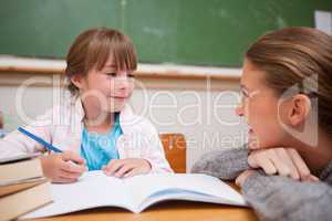 A teacher and a schoolgirl talking