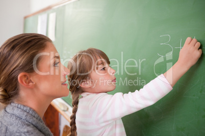 Teacher and a pupil making an addition