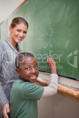 Portrait of a teacher explaining mathematics to a pupil