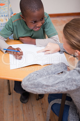 Portrait of a teacher explaining something to a schoolboy