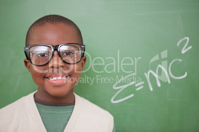 Schoolboy posing with the the mass-energy equivalence formula