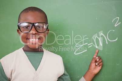 Schoolboy showing the the mass-energy equivalence formula