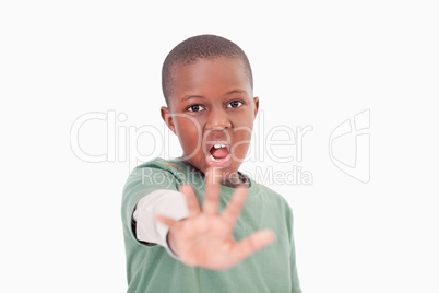 Boy saying stop with his hand