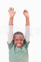 Portrait of a boy raising his arms
