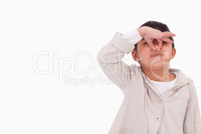 Girl pinching her nose