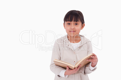 Young girl reading a book