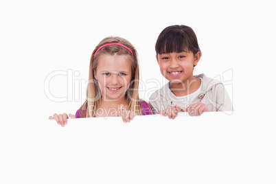 Girls behind a blank panel