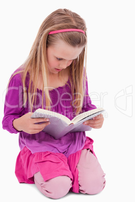 Portrait of a girl reading a book