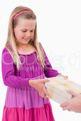 Portrait of a girl receiving a present