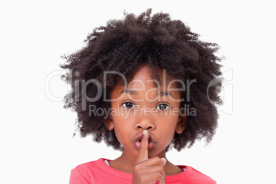 Close up of a girl asking silence