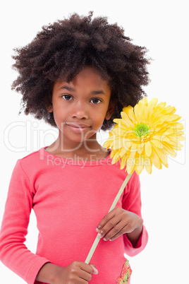 Portrait of a girl holding a flower