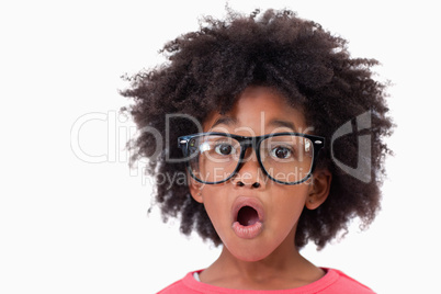 Close up of a shocked smart girl