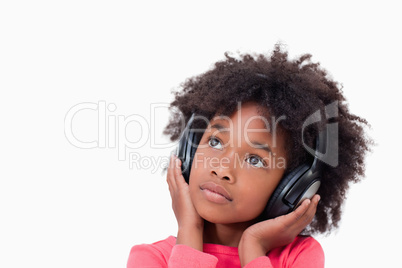 Close up of a quiet girl listening to music