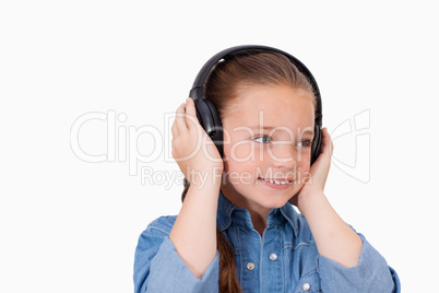 Smiling girl listening to music