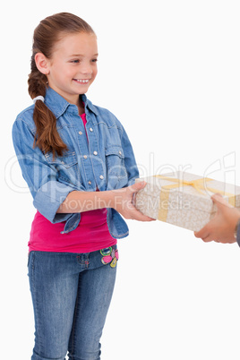 Portrait of a girl receiving a gift