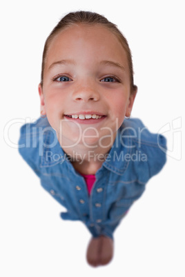 Portrait of a playful girl smiling at the camera