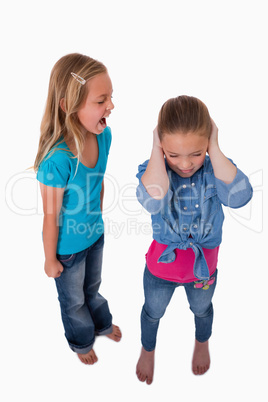 Portrait of a girl screaming at her friend