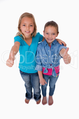 Portrait of girls with the thumbs up
