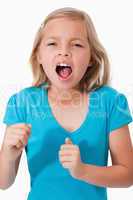 Portrait of a young girl screaming