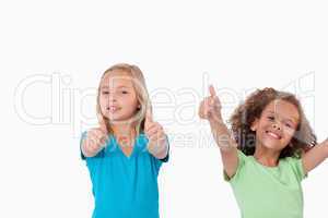 Cheerful girls with the thumbs up