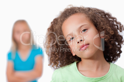 Girl posing with her friend in the background