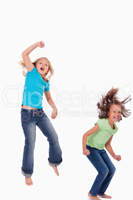 Portrait of girls jumping