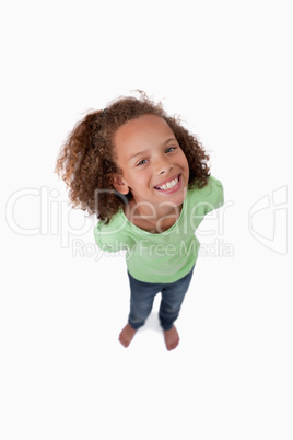 Portrait of a cute playful girl smiling at the camera