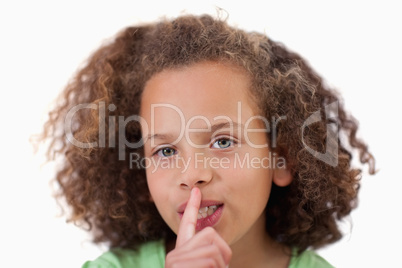 Close up of a girl asking for silence