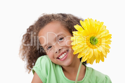 Little girl holding a flower