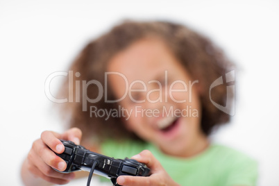 Smiling girl playing a video game