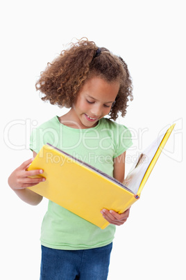 Portrait of a girl reading a fairy tale