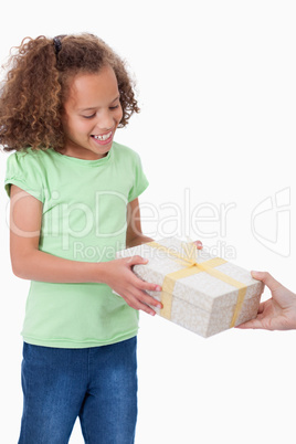 Portrait of a young girl receiving a present